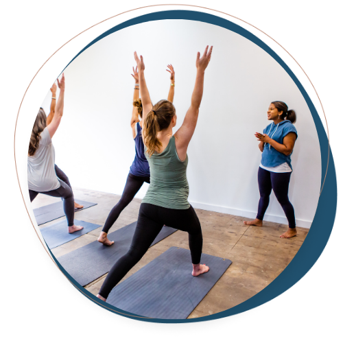 instructor teaching a yoga class