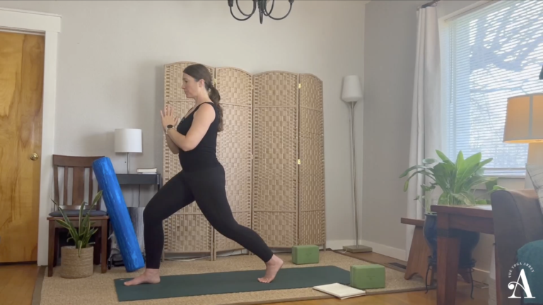 Jamie Terry in Crescent Lunge with hands at heart