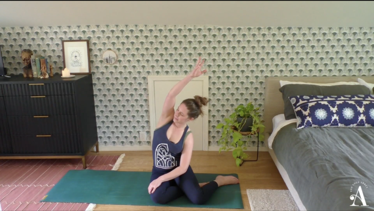 Caroline Williams in seated side bend