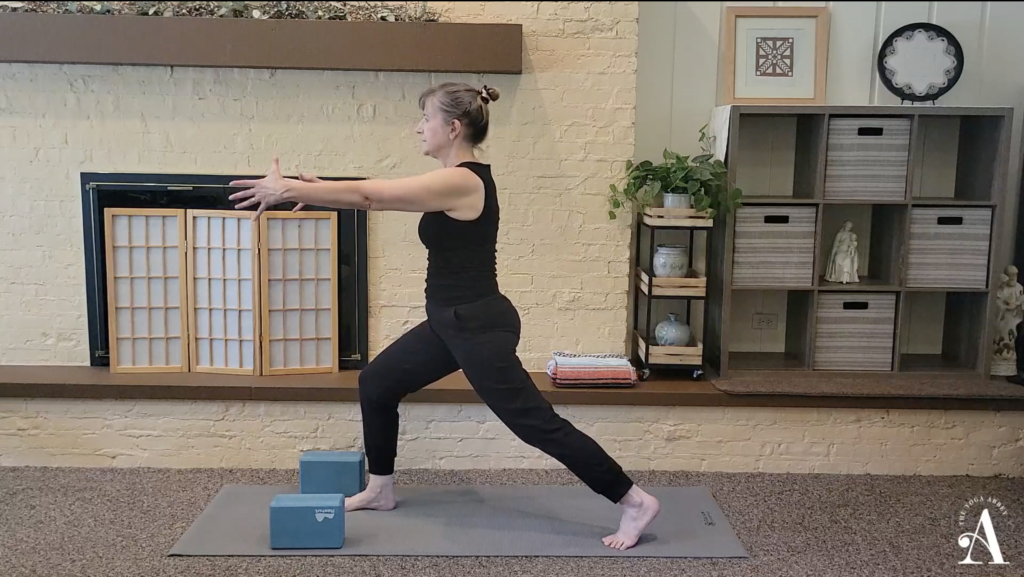 Dimitra in Crescent Lunge with arms forward